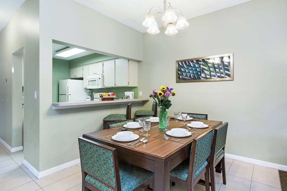 Gather for meals at a set table beside the kitchenette.