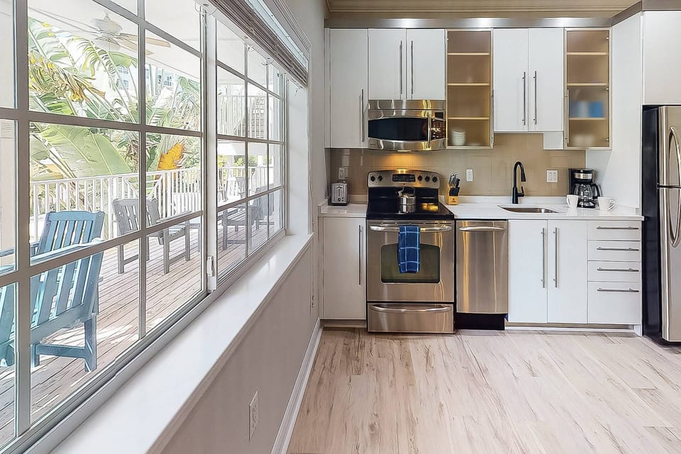 Great view of the open shared patio from the full kitchen.
