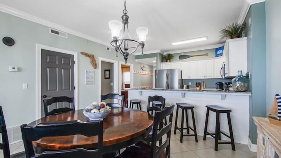 Large dining room table and bar stools offer multiple indoor seating options
