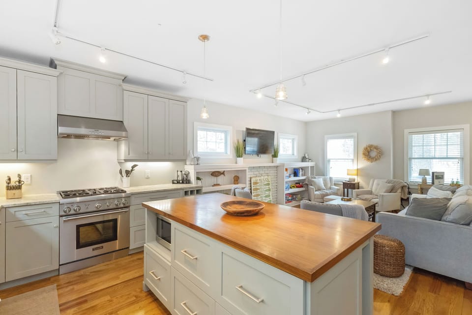 Island at the bar in this open concept kitchen and living area