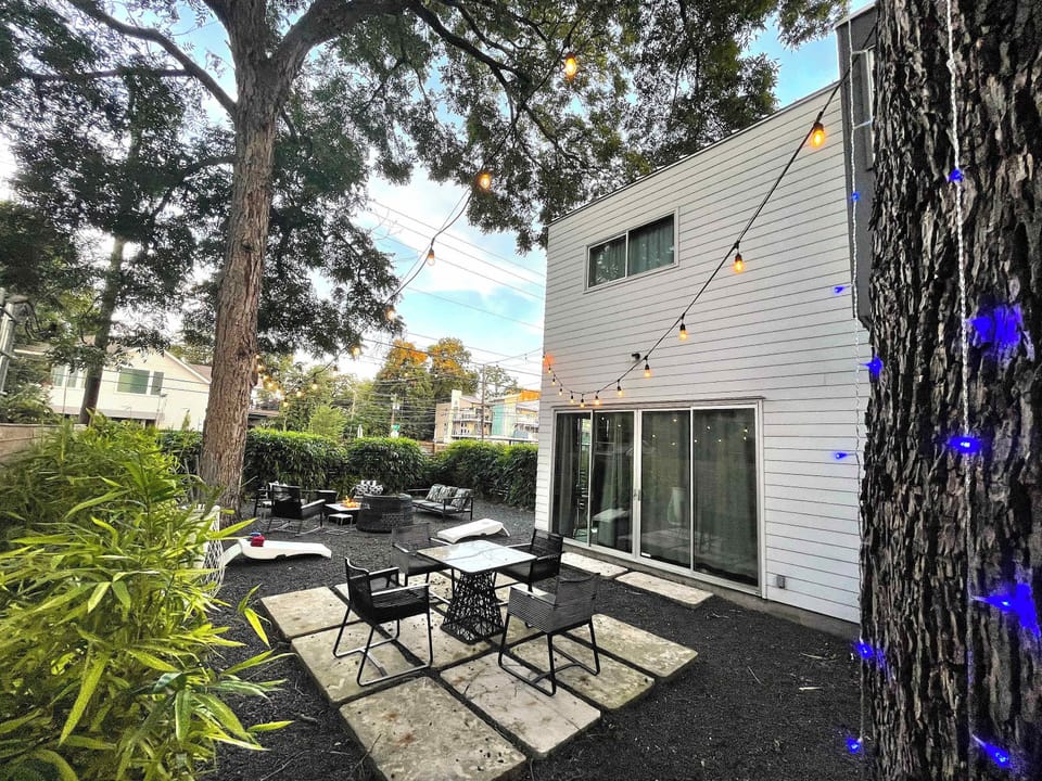 Outdoor Seating Area Surrounded By Greenery, Ideal For Gatherings