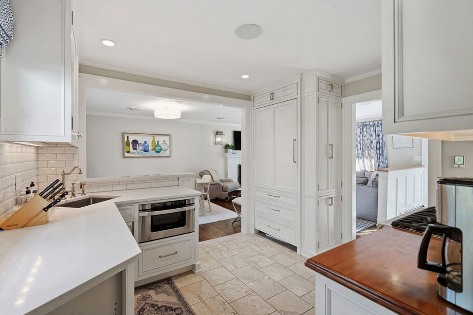 Kitchen with gas range and stone counters