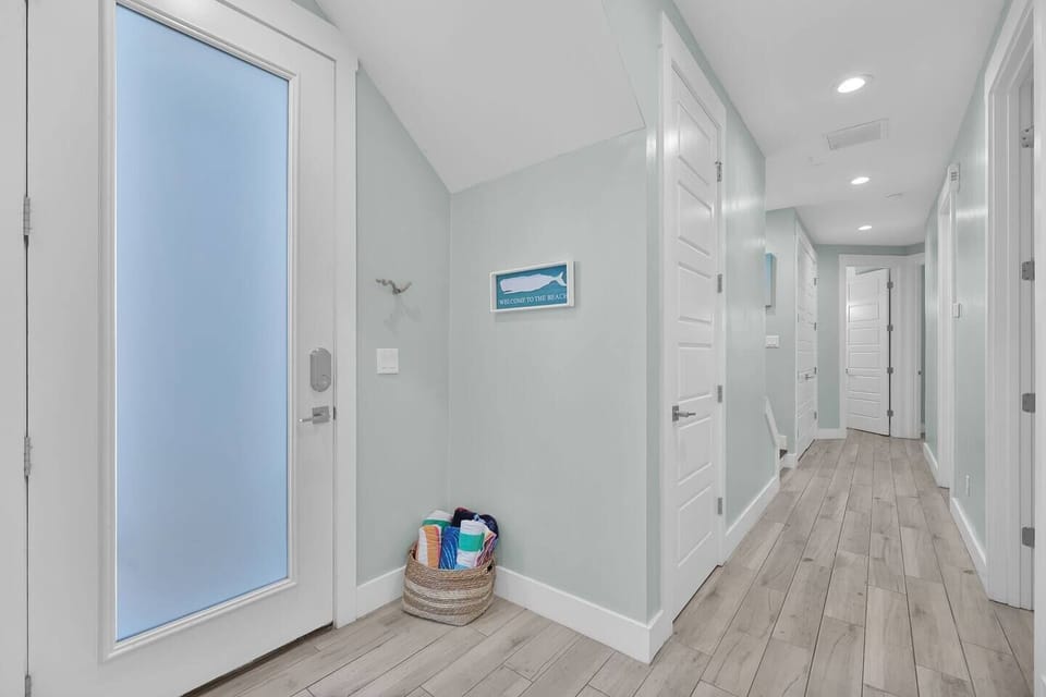 First floor has three bedrooms, access to private backyard, and laundry as well as a full bathroom. 
