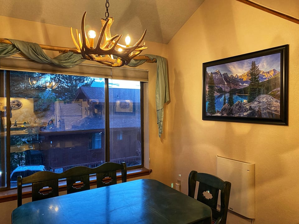 Dining room with a big window, perfect place when it's snowing outside!