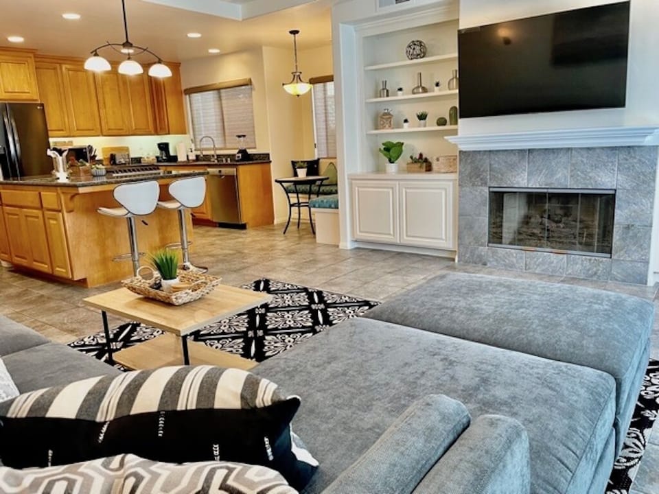 Living room with large sectional couch and smart tv 