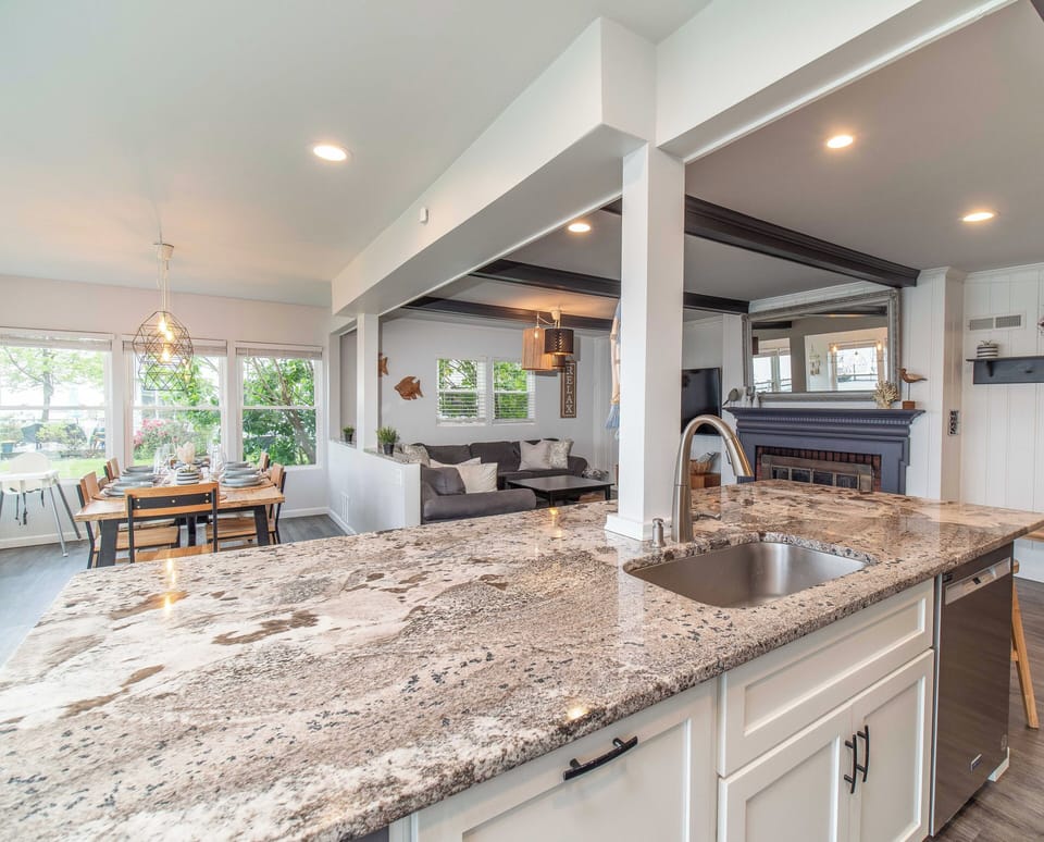 Open concept first floor living area with ample seating and comfortable couch (1)