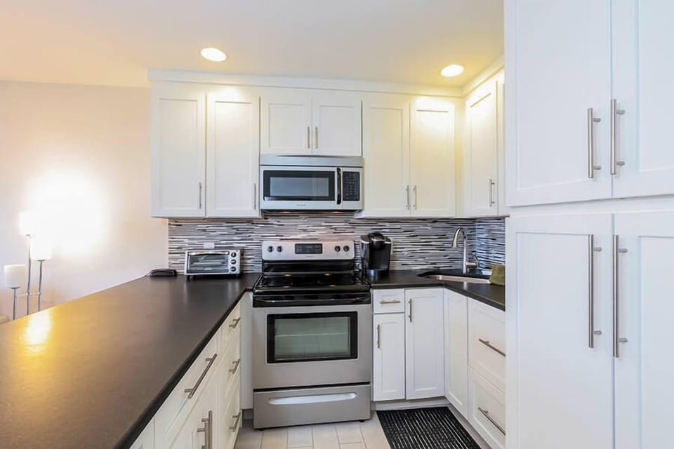 Kitchen is well-equipped with updated appliances