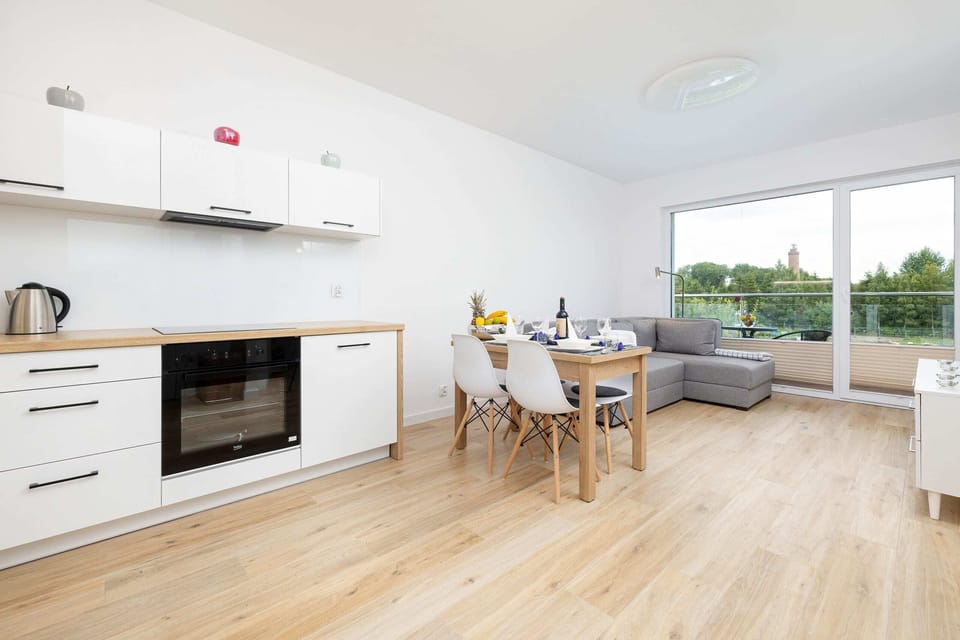 Open-plan kitchen with dining space and modern appliances
