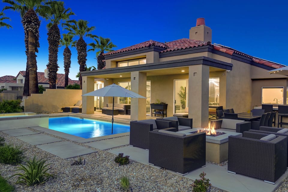 FIRE PIT TO POOL AND BACK OF HOUSE