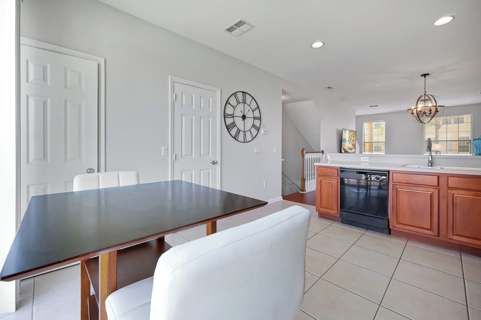 Your open kitchen flows into the dining area, where modern appliances and warm wood tones create the perfect space for memorable meals together.
