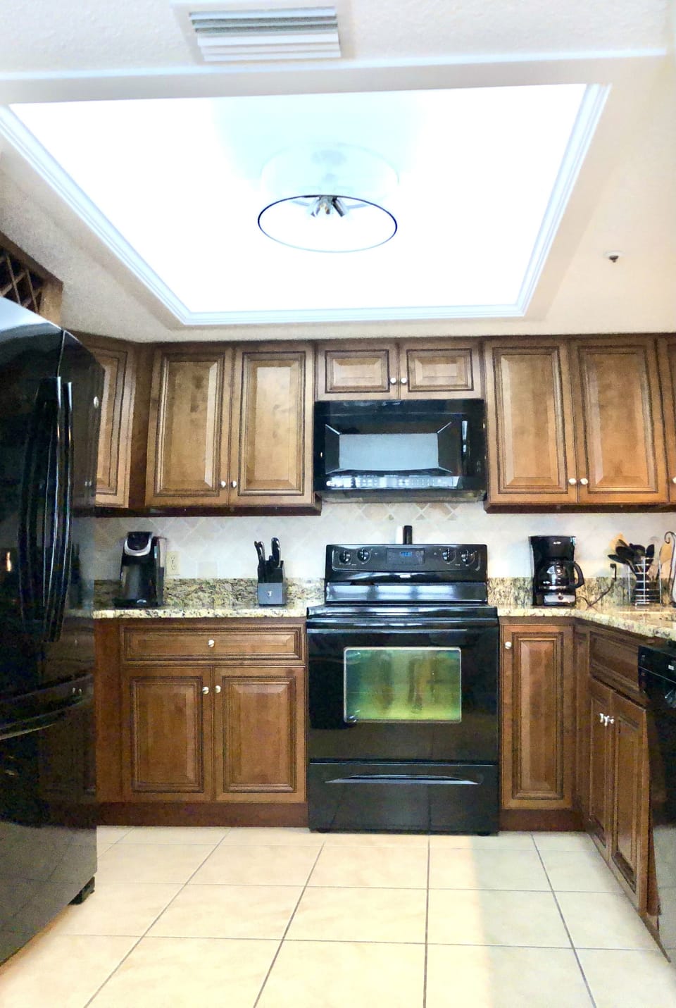 Fully Equipped Kitchen with variety of cookware, plates, utensils, storage, etc.