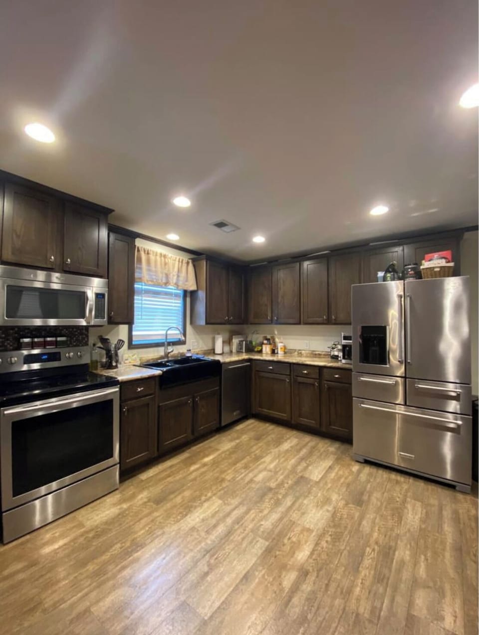 Kitchen stocked with pots, dishes, etc plus empty cabinets for your groceries.