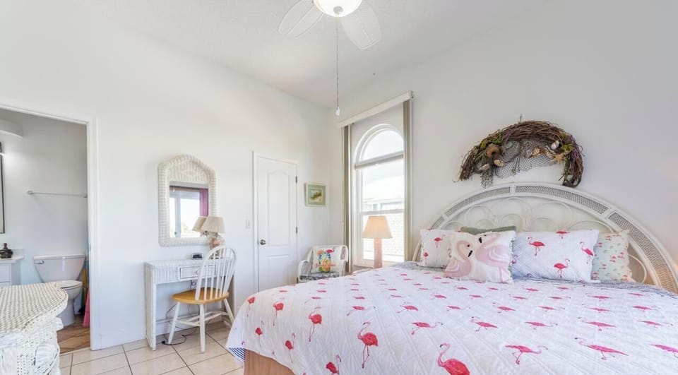 Bright and airy bedroom with charming coastal decor and natural light