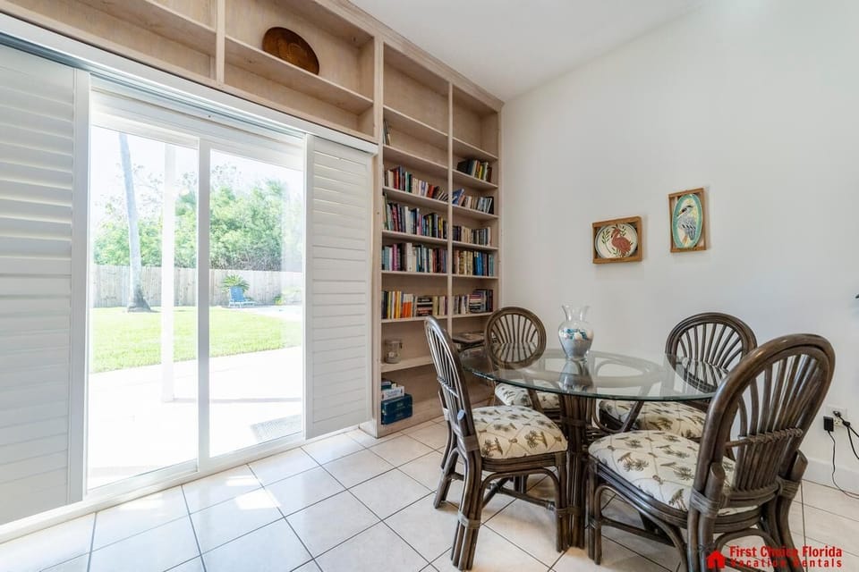 Sunlit dining nook with garden views and cozy charm
