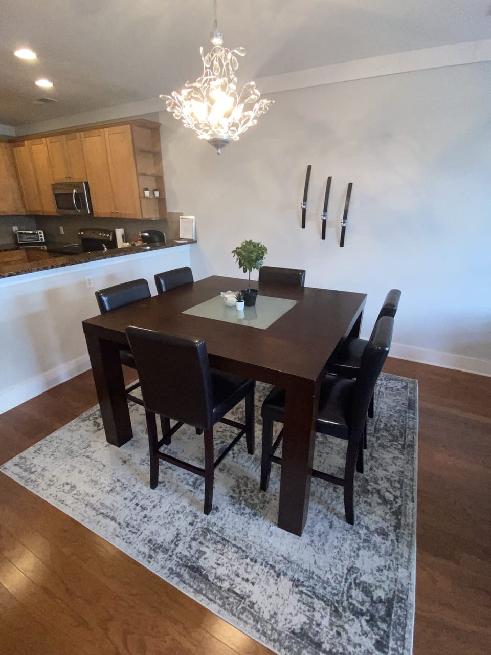 The oversized dining table has six chairs and a bench seat.