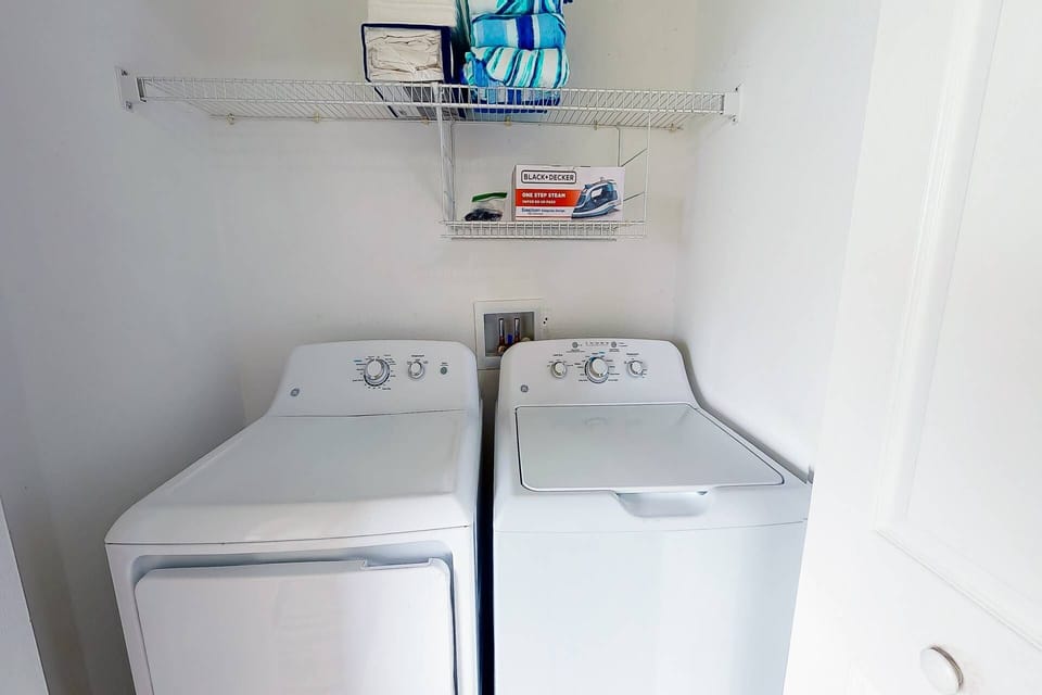 full size washer/dryer on the main level in kitchen area.