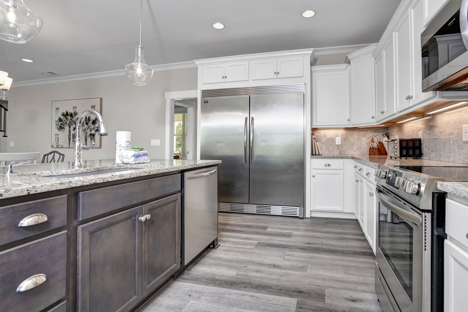 Your gourmet kitchen awaits with granite counters, stainless appliances, and pendant lighting for memorable meal prep.