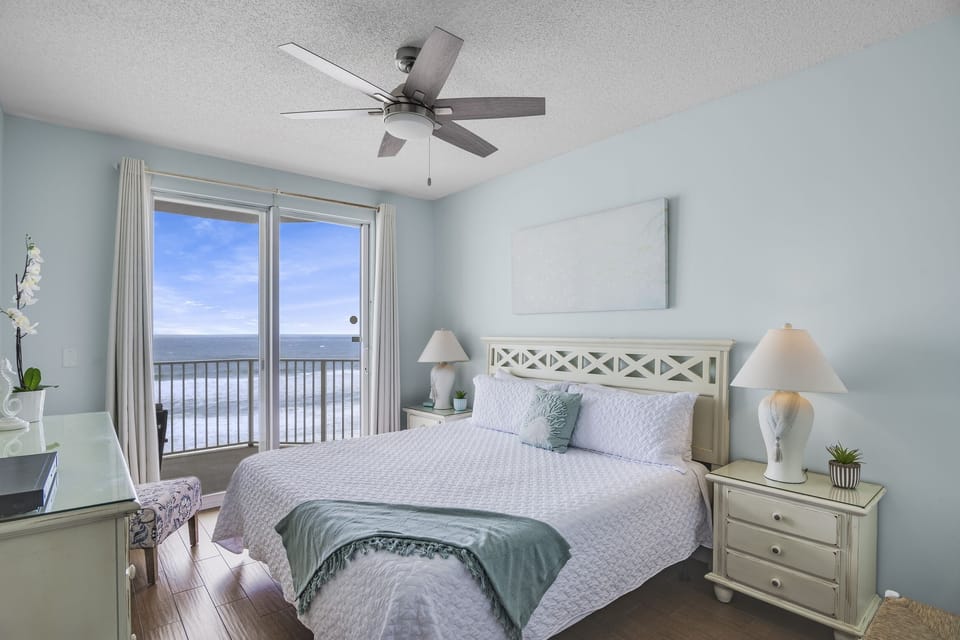 King bed with balcony access in master bedroom (+ TV, private closet with Twin Rollaway bed, and private bathroom) - Wake up to those beautiful Gulf of Mexico views!