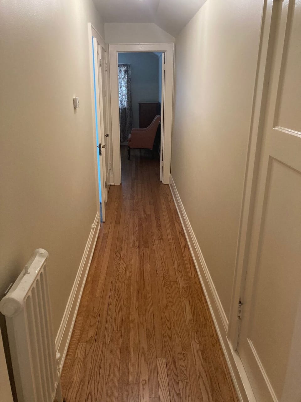 Hallway leading from living room to bedroom and bathroom