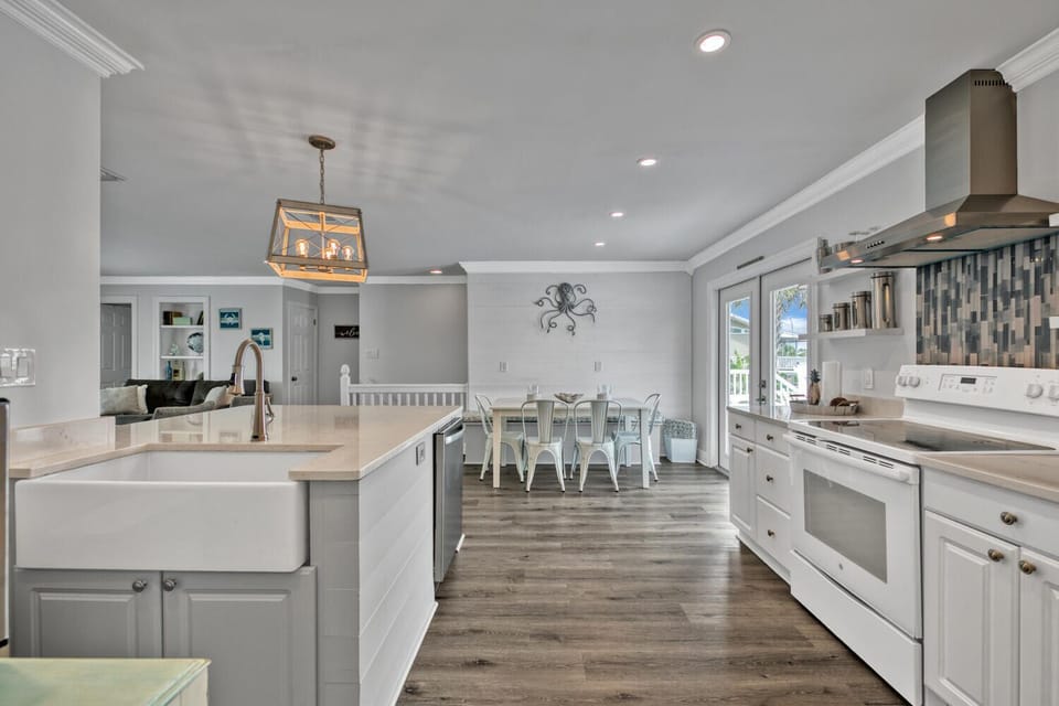 2nd fl main living open concept, kitchen & dining. Front & back balcony access. 