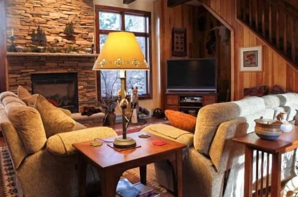 Gas fireplace in 2nd family room. Very comfy couches & nice view of rock garden