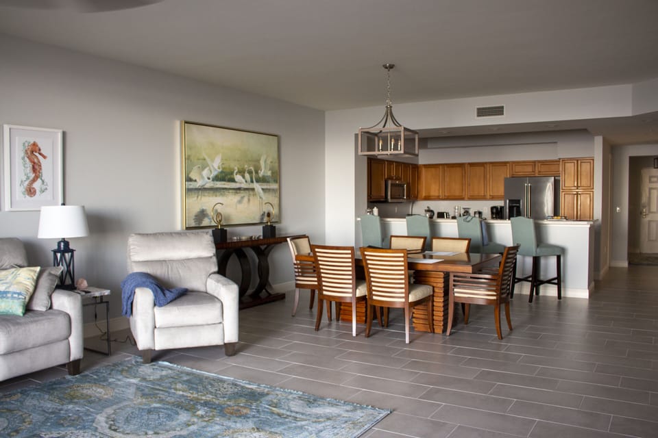 Panoramic of Living, Dining, and Kitchen Space

