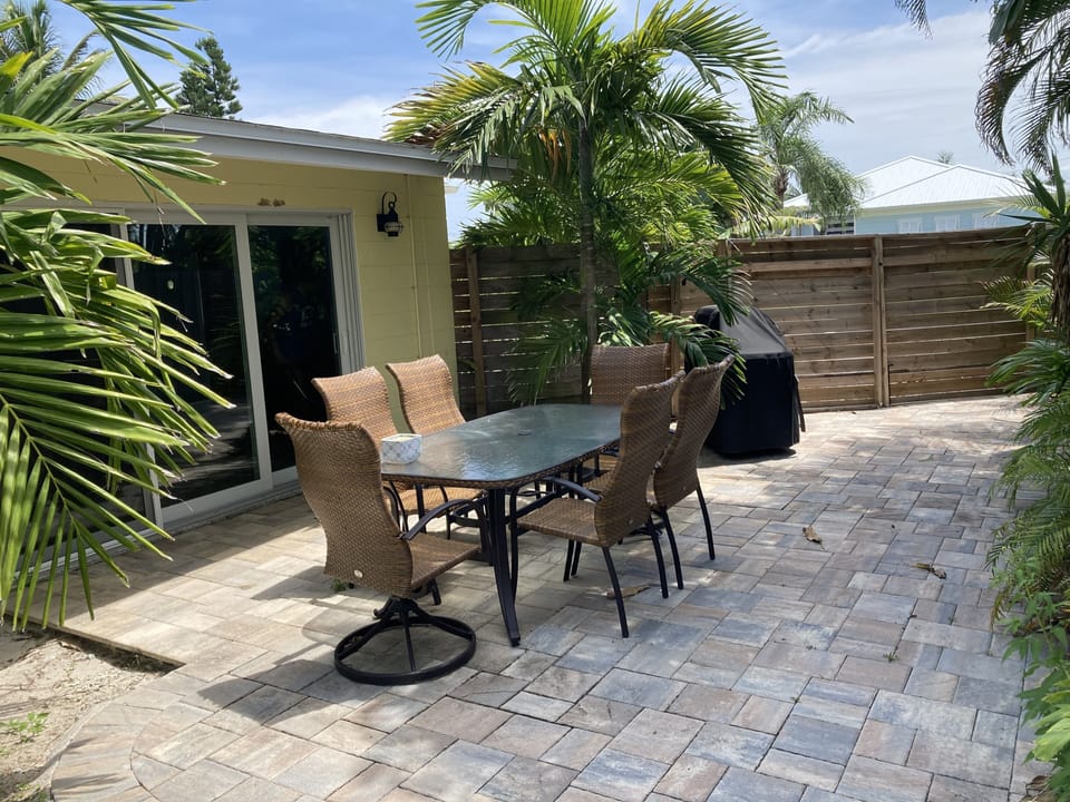 Patio table with plenty of shade and grill