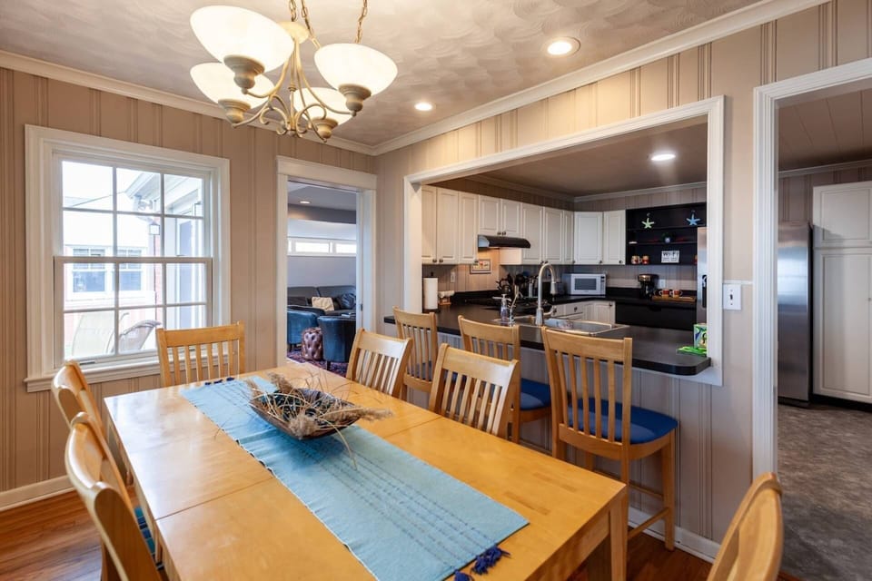 The dining room is easily accessible to to the kitchen and all of the family gathering spaces.