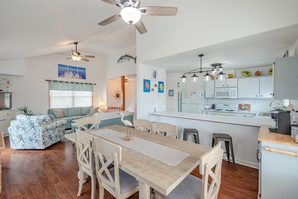 Dining area looks into kitchen/bar area