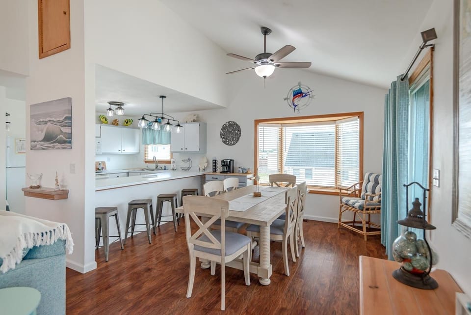 Plenty of natural light in the common area with beautiful coastal accents