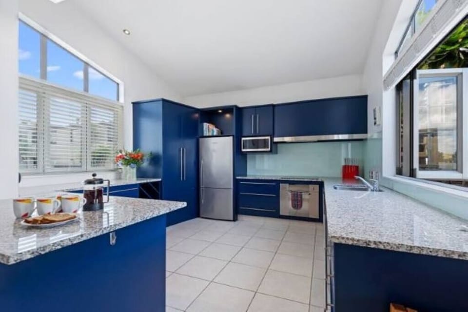 Kitchen with serveries to outdoor patios.