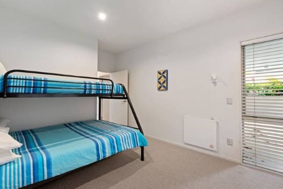 Ground floor bedroom 2 with double bunk bottom bed, single bed top and pull out single trundle bed.