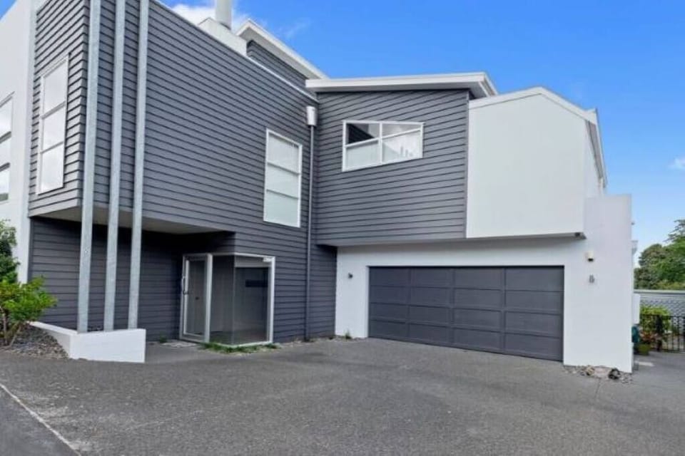 Front exterior and double garage.