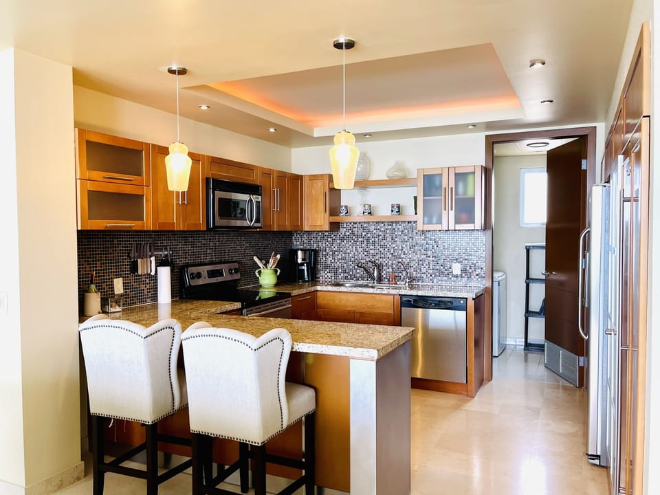 Fully equipped kitchen with stainless steel appliances 