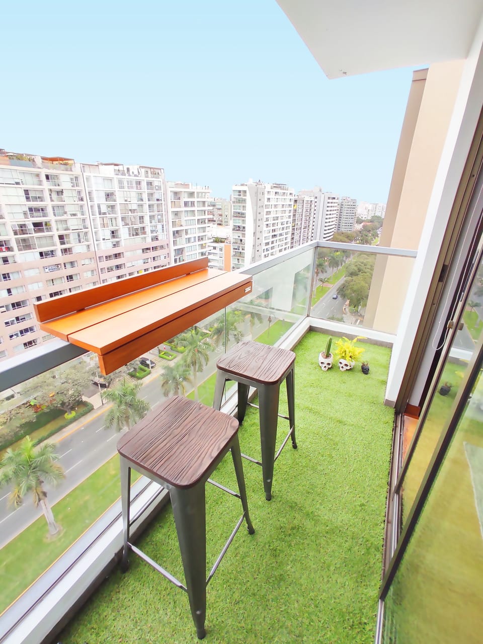 A relaxing balcony with great city views while enjoying a beverage!