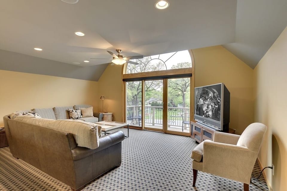 Upstairs game room with 80 inch flat screen TV