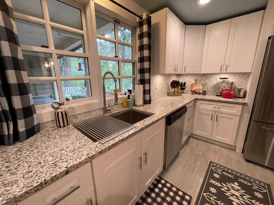 Huge window over huge sink, listen to the creek as you cook 
