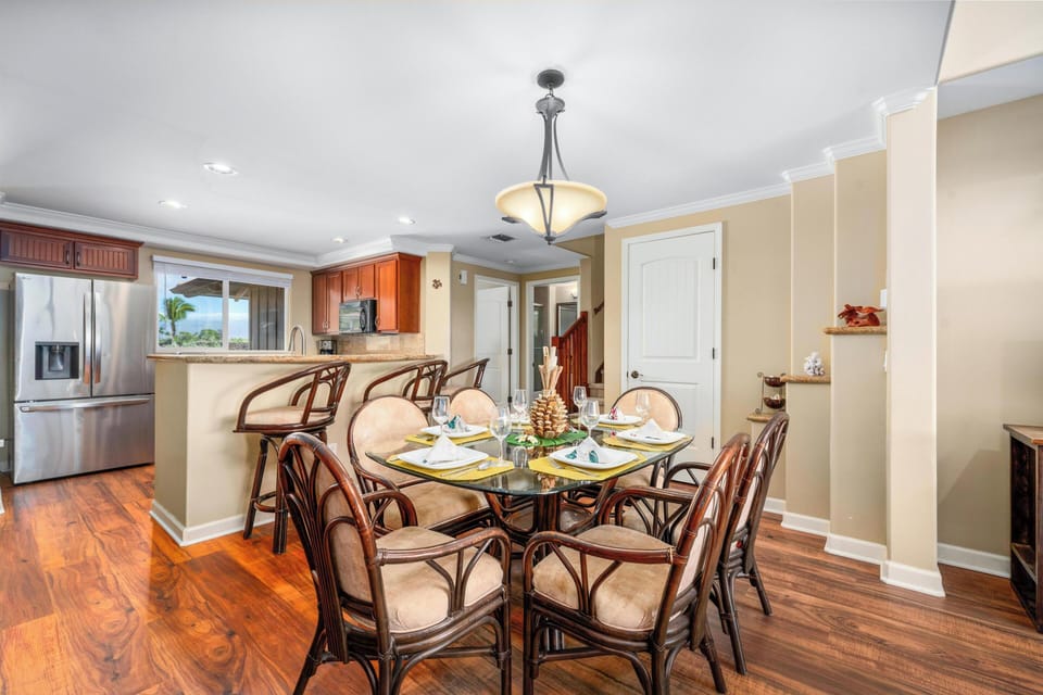 Dining area with glass top table and seating for six