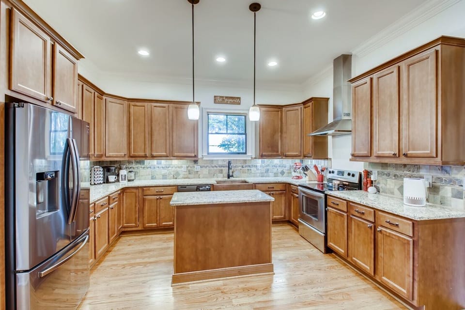 Gourmet kitchen w/ copper farmhouse sink, oven, stove, microwave and Keurig. 