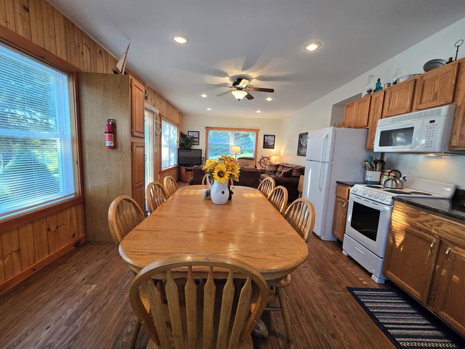 Dining area with open floor concept & beautiful view of the lake.