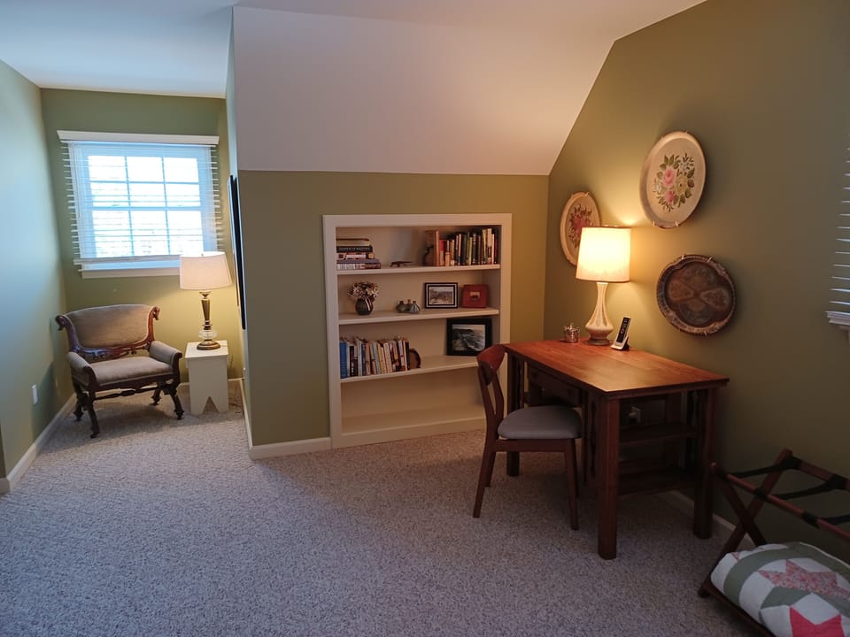 Upstairs bedroom #3 seating and desk area. 