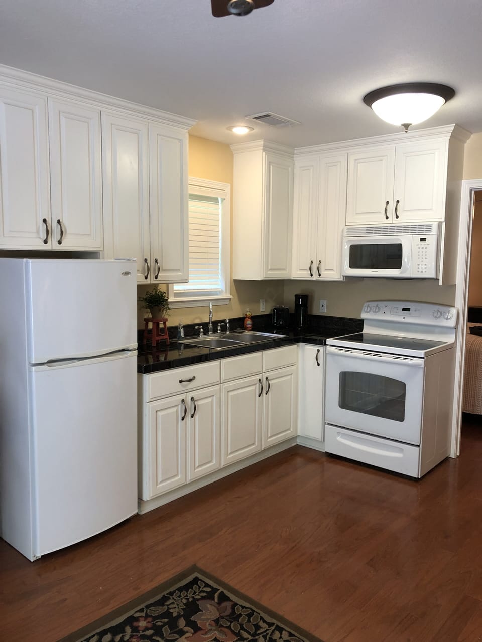 Full kitchen with utensils.