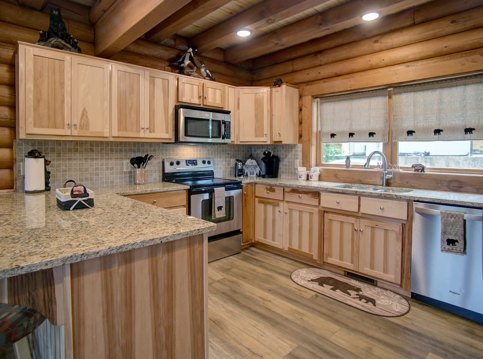 Fully Equipped kitchen with granite counter tops and stainless steel appliances.