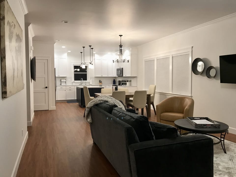 View from the front door looking into the living room, dining room & kitchen
