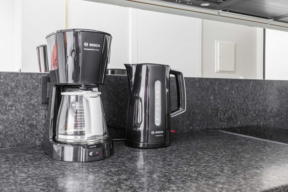 Coffee and tea corner with modern equipment for your convenience.