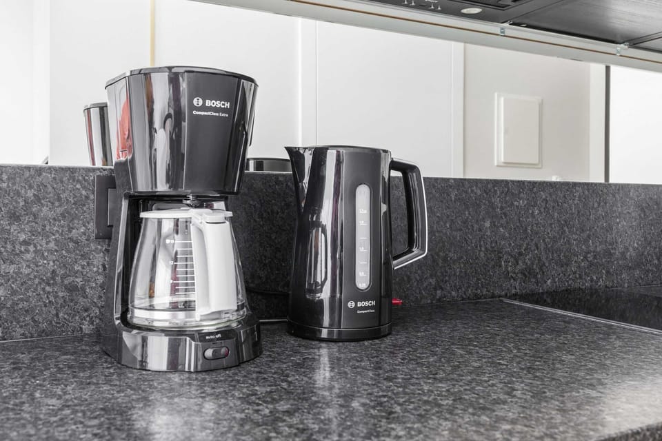 Coffee and tea corner with modern equipment for your convenience.