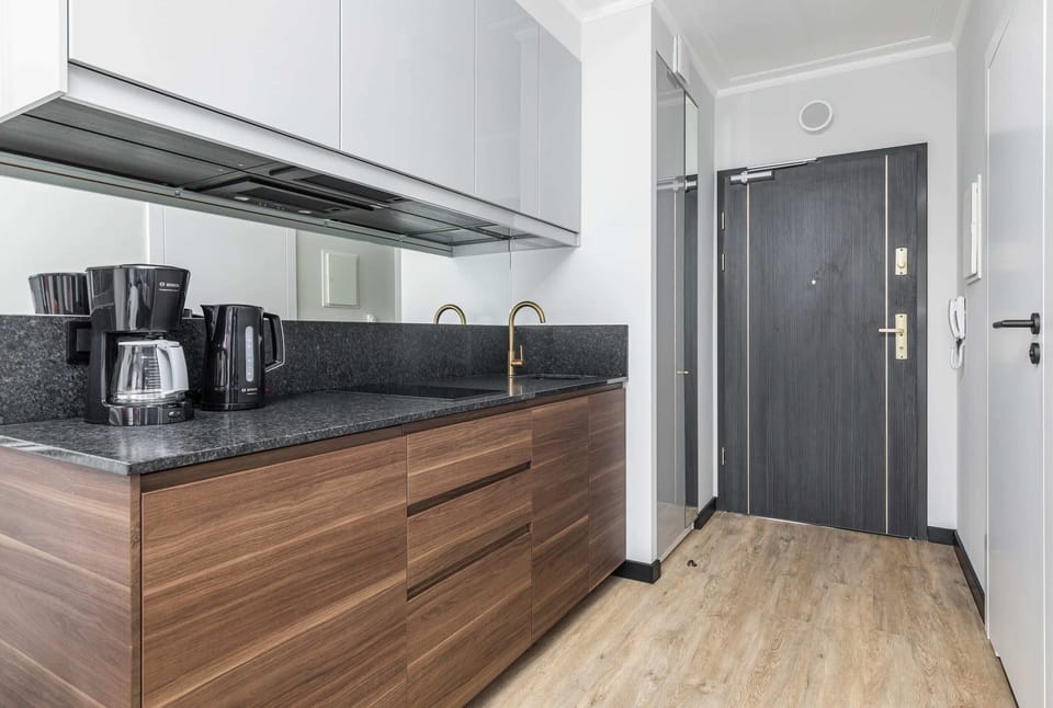 Functional kitchen with wooden cabinets and modern appliances.
