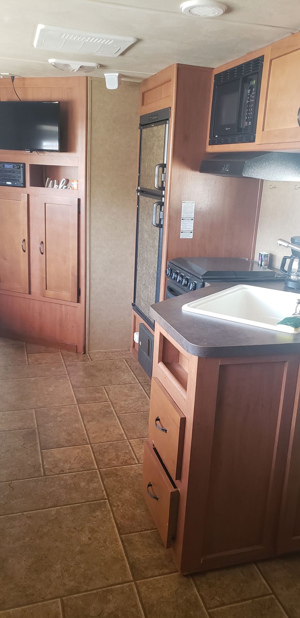 kitchen area/ living room with tv