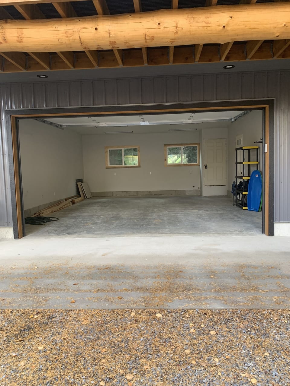 Heated two car garage and drive way with ski/snow board racks and sleds