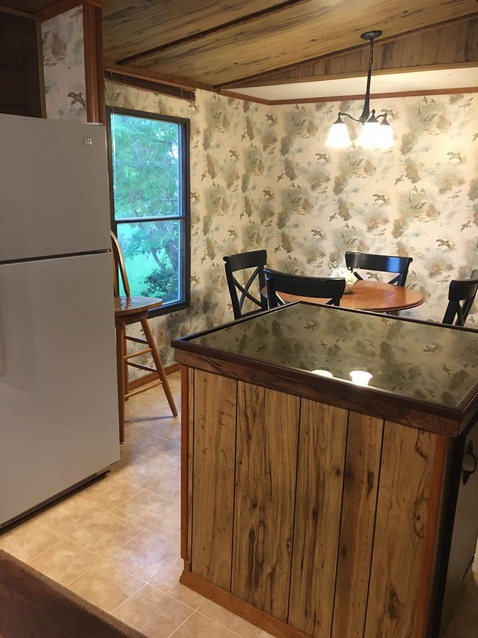 Kitchen island with glass top.  Wood, drop leaf kitchen table with seating for 4